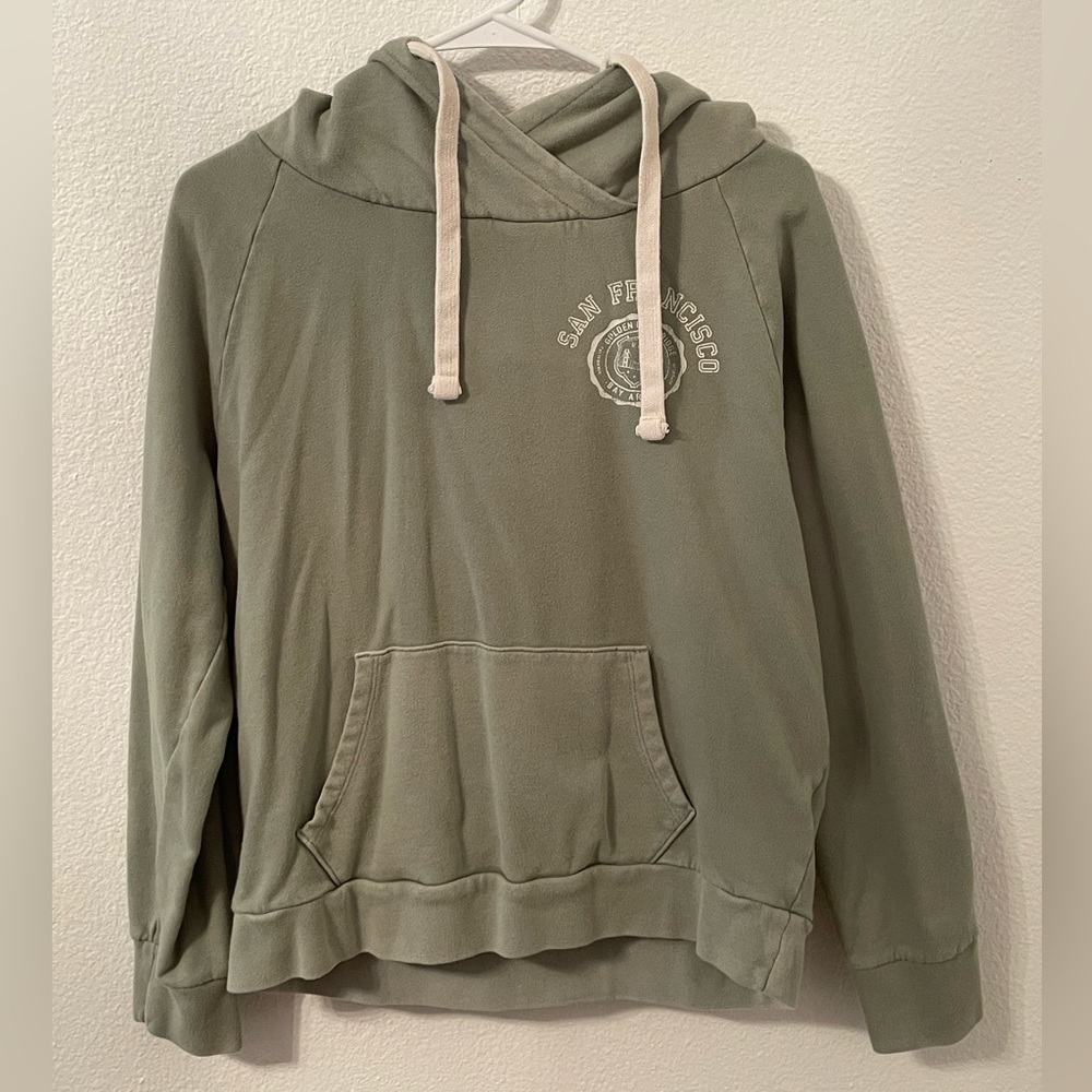 This is a sage, green hoodie with San Francisco and printed on the front